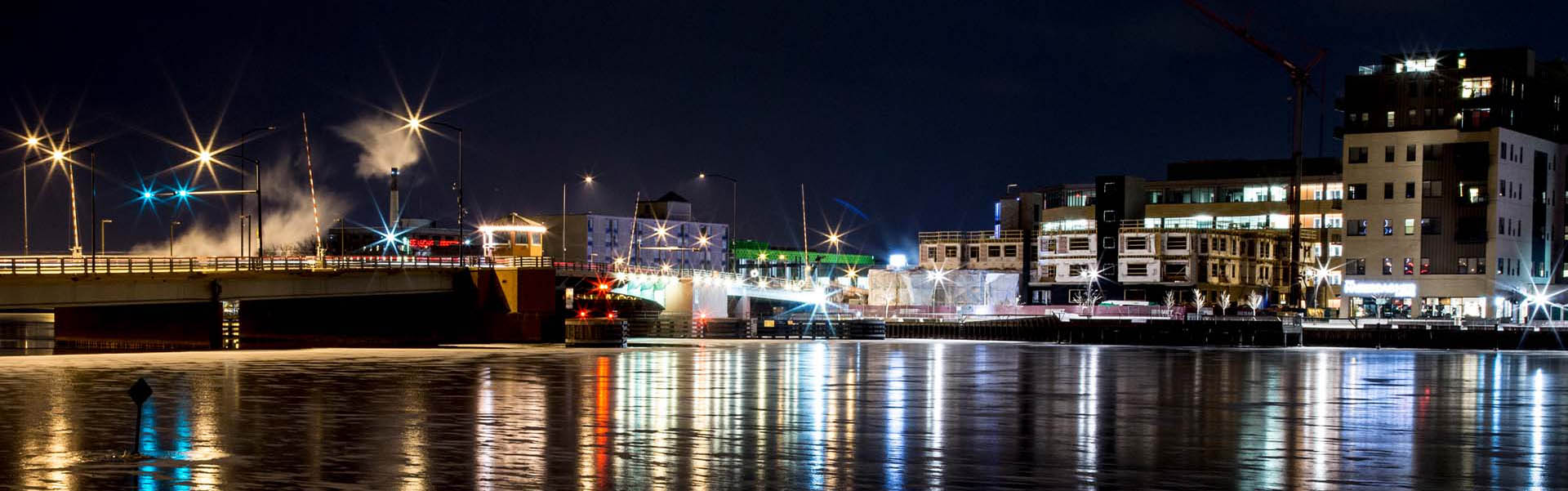 Neon color image of a band playing and people singing along